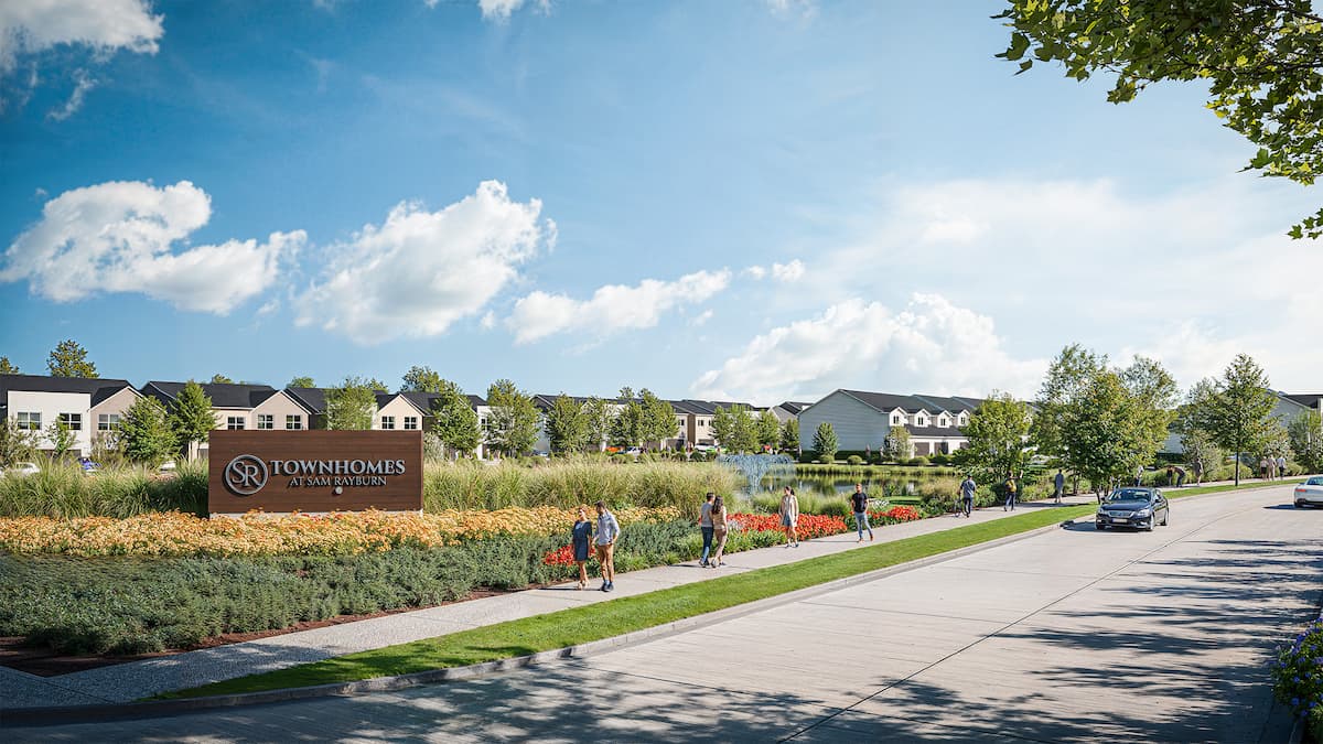 Modern townhomes in Minerva Heights with landscaped walkways and green spaces.