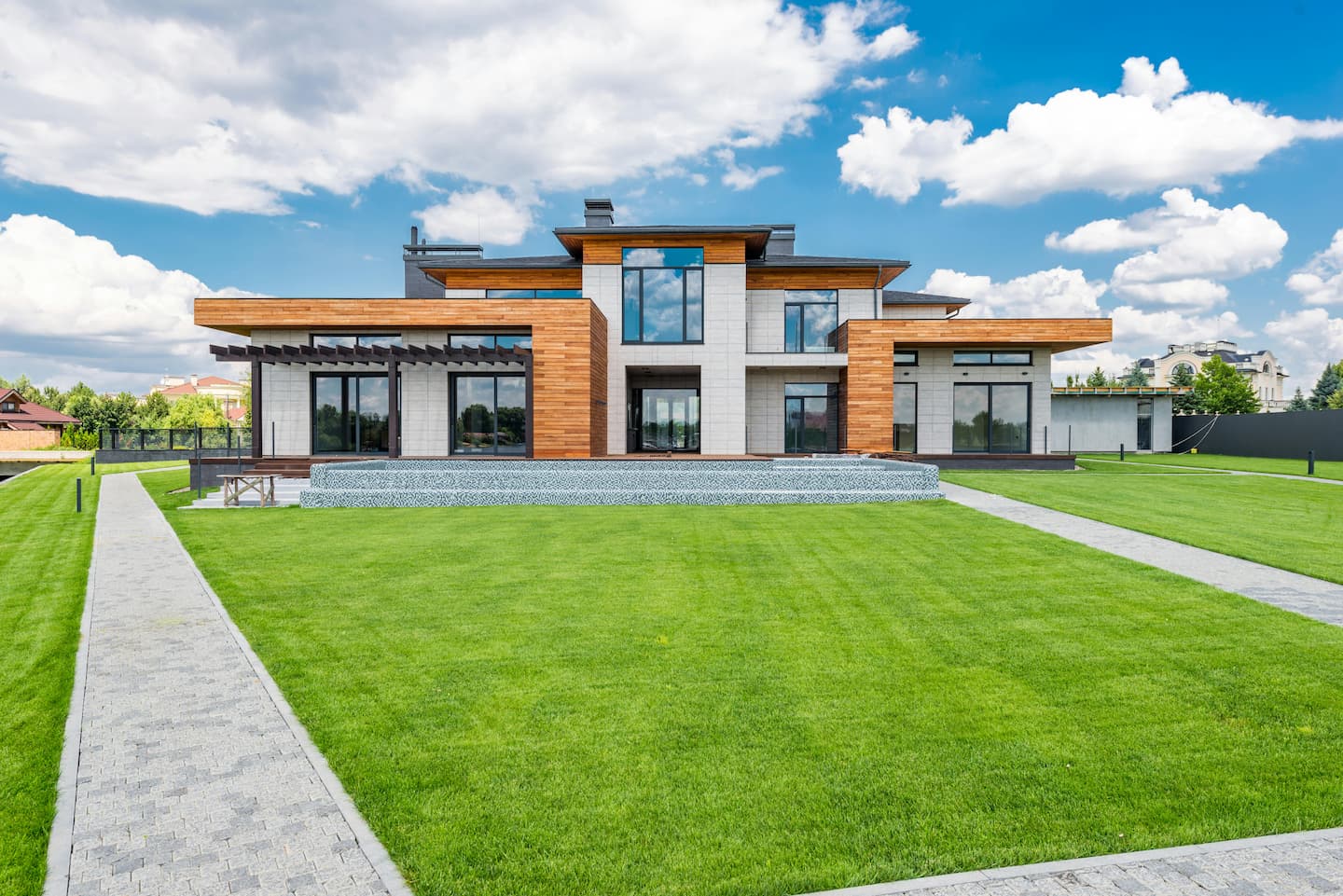 Modern luxury house with expansive green lawn and contemporary design at Minerva Heights.